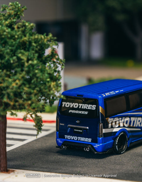 Load image into Gallery viewer, Tarmac Works 1/64 Toyota Hiace Widebody Toyo Tires Model Truck
