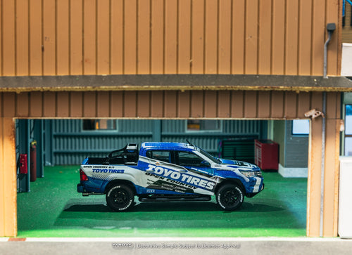 Load image into Gallery viewer, Tarmac Works 1/64 Toyota Hilux  Toyo Tires Diecast model car
