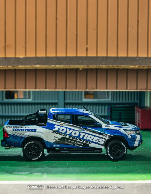 Load image into Gallery viewer, Tarmac Works 1/64 Toyota Hilux  Toyo Tires Diecast model car
