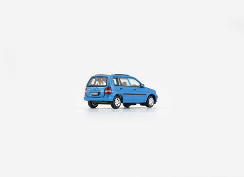 Load image into Gallery viewer, BMC 1/64 Mazda 1994 Demio (Metro) - Blue (RHD) Model with figures
