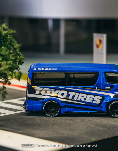 Load image into Gallery viewer, Tarmac Works 1/64 Toyota Hiace Widebody Toyo Tires Model Truck
