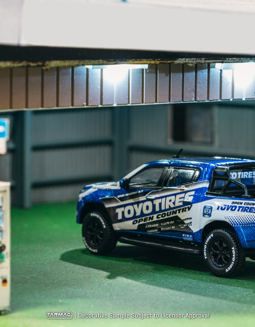 Load image into Gallery viewer, Tarmac Works 1/64 Toyota Hilux  Toyo Tires Diecast model car
