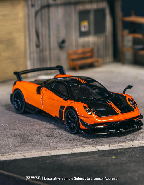 Load image into Gallery viewer, Tarmac Works 1/64 Pagani Huayra BC Arancio Saint Tropez Model Car
