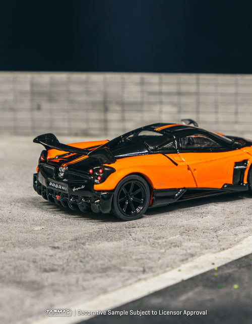 Load image into Gallery viewer, Tarmac Works 1/64 Pagani Huayra BC Arancio Saint Tropez Model Car
