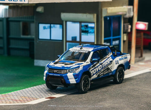 Load image into Gallery viewer, Tarmac Works 1/64 Toyota Hilux  Toyo Tires Diecast model car
