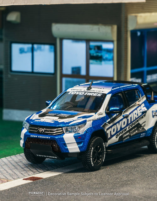 Load image into Gallery viewer, Tarmac Works 1/64 Toyota Hilux  Toyo Tires Diecast model car
