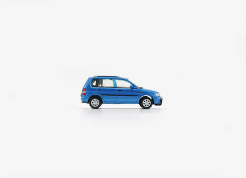 Load image into Gallery viewer, BMC 1/64 Mazda 1994 Demio (Metro) - Blue (RHD) Model with figures
