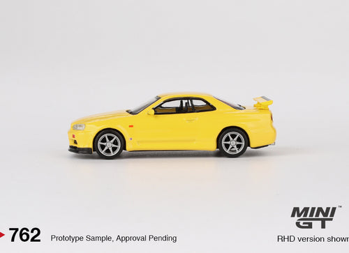 Load image into Gallery viewer, Mini GT #762 Nissan Skyline GT-R R34 Vspec Lighting Yellow (RHD)

