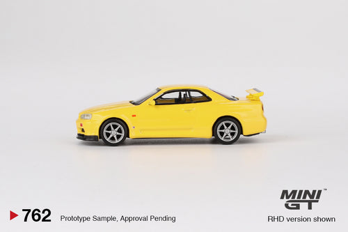 Load image into Gallery viewer, Mini GT #762 Nissan Skyline GT-R R34 Vspec Lighting Yellow (RHD)

